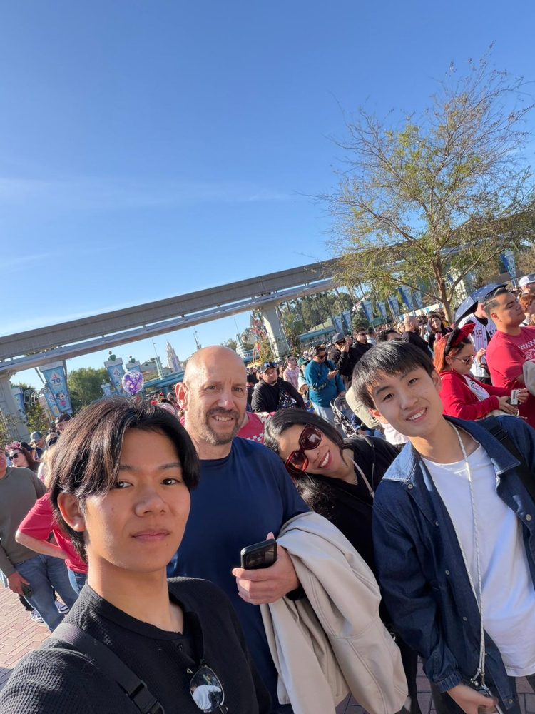 Host family with students at Disneyland