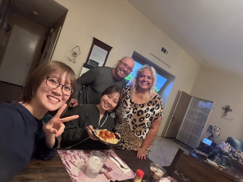 Host family enjoying dinner with students